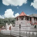 a large white building with a red roof