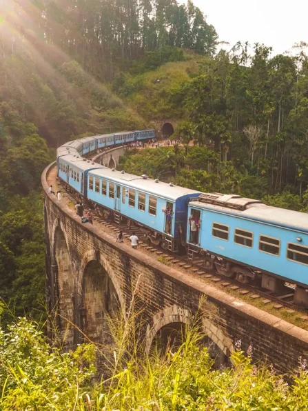 Photo by Adam Vandermeer blue and white train on rail tracks