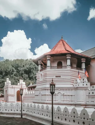 Photo by Promodhya Abeysekara a large white building with a red roof